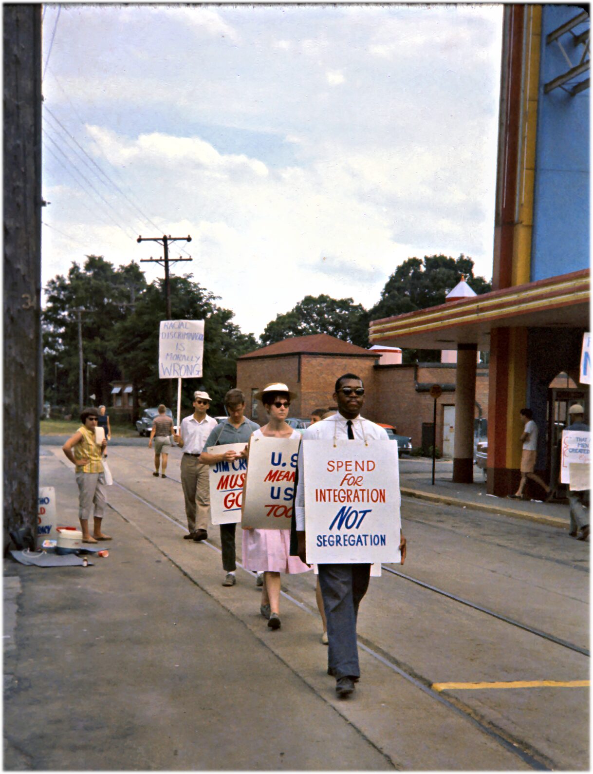 Protesters with sandwich board signs