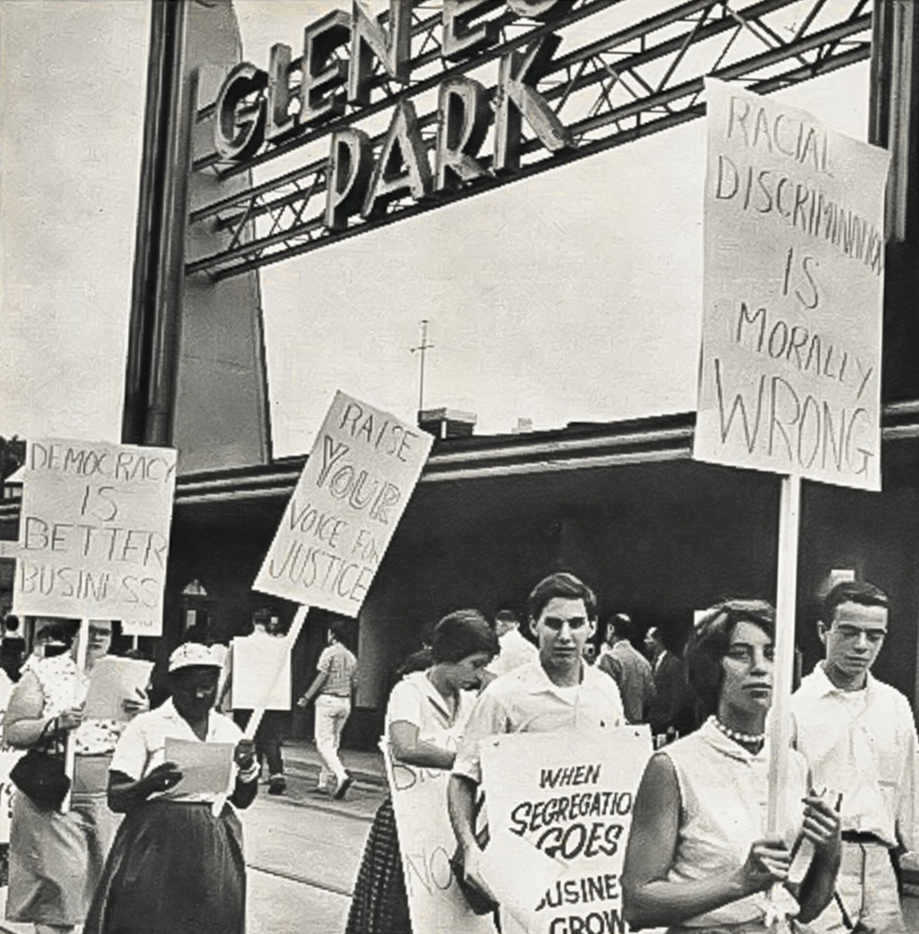 Black and White historic photo of picketers with the Glen Echo sign in the background