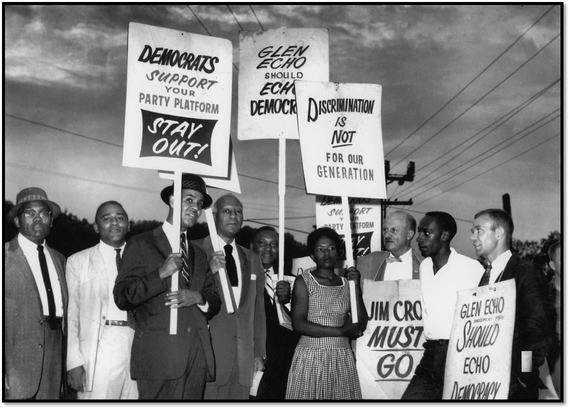 Historic, black and white photo of people picketing.